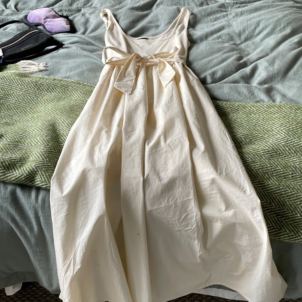Cream floor length dress with adjustable belt. Size medium.